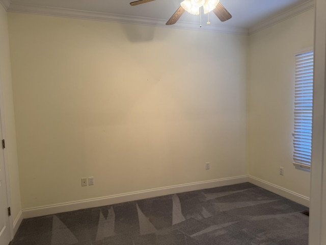 empty room featuring ceiling fan, ornamental molding, and dark colored carpet