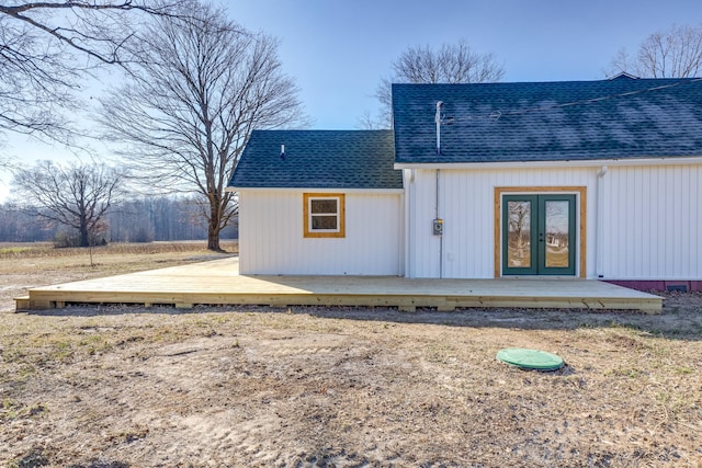 rear view of property featuring french doors