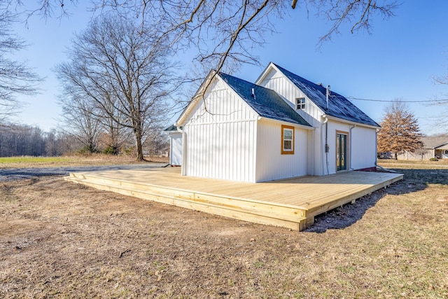 back of property featuring a deck