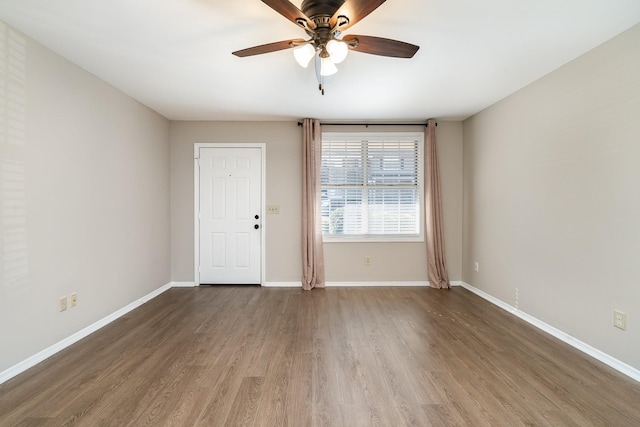 unfurnished room with wood-type flooring and ceiling fan