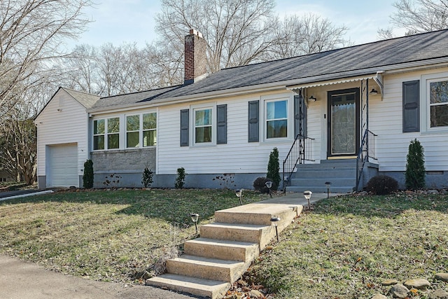 single story home with a garage and a front lawn