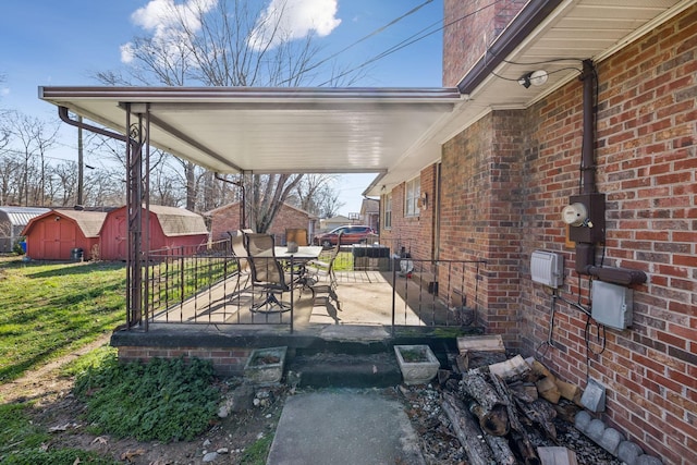 view of patio / terrace with a storage shed