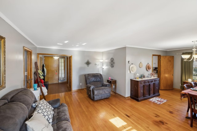 living room featuring light hardwood / wood-style floors and ornamental molding