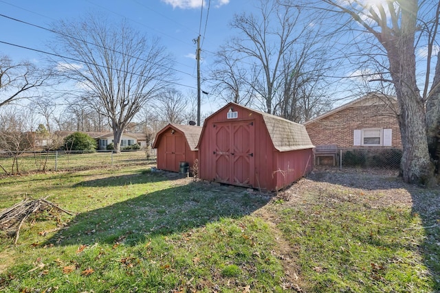 view of outdoor structure featuring a lawn