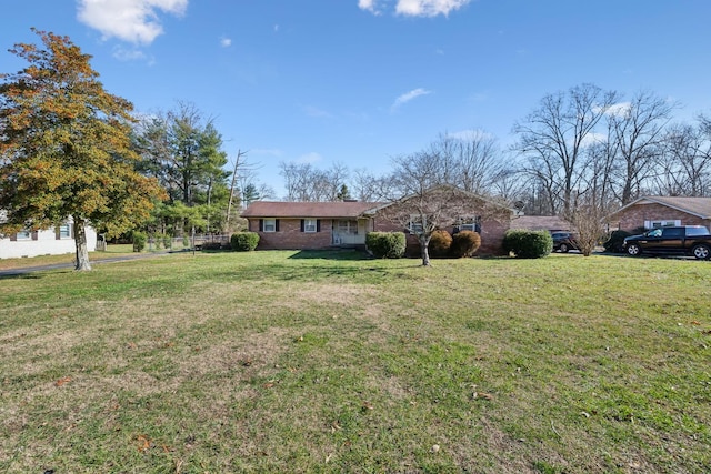 single story home with a front yard