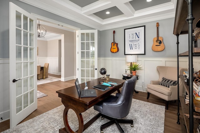 office space with french doors, coffered ceiling, crown molding, beamed ceiling, and a notable chandelier