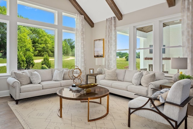 sunroom / solarium with vaulted ceiling with beams