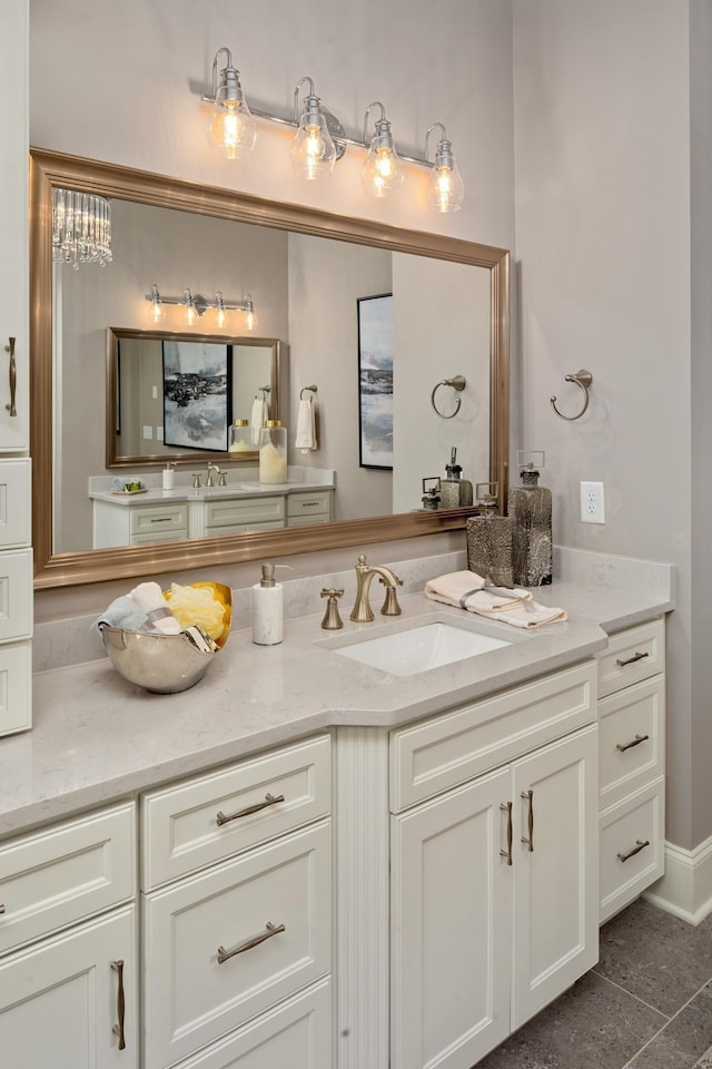 bathroom featuring tile patterned flooring and vanity