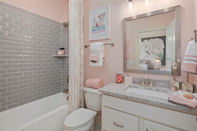 full bathroom with shower / bath combo, toilet, and vanity