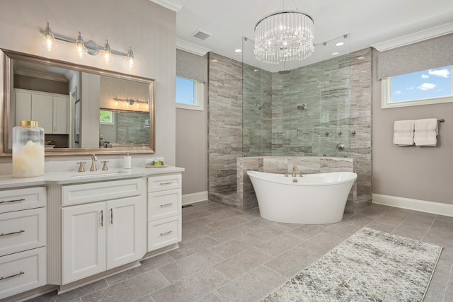 bathroom featuring vanity, ornamental molding, plus walk in shower, and a chandelier