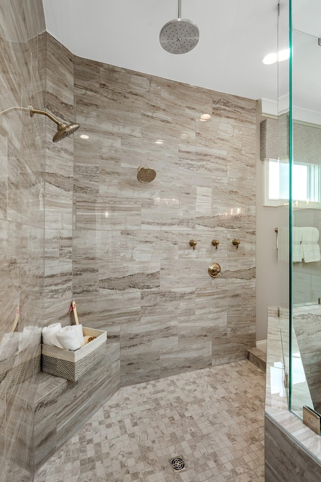 bathroom featuring a tile shower