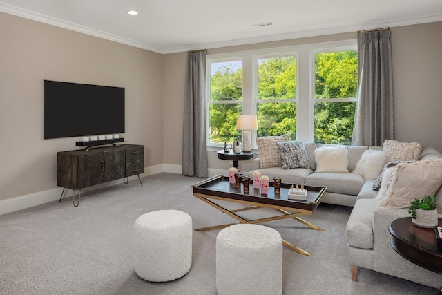 carpeted living room with ornamental molding