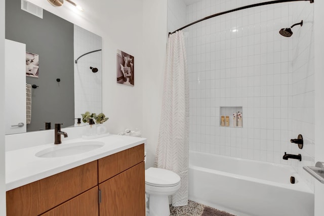 full bathroom with shower / bathtub combination with curtain, vanity, and toilet