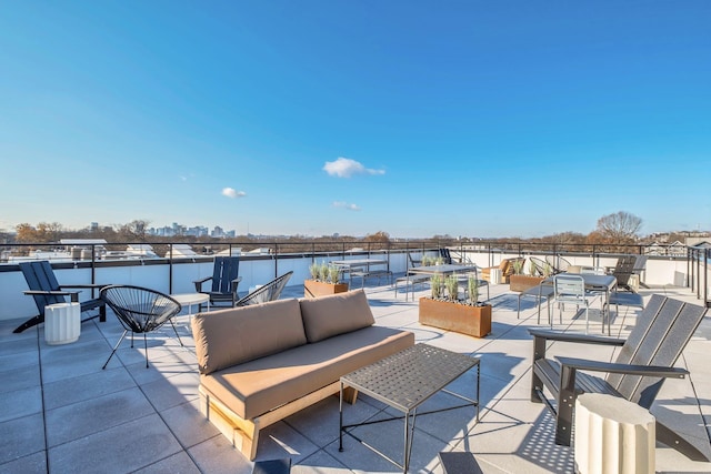 view of patio with outdoor lounge area and a water view