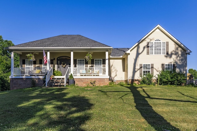 view of front of home with a porch and a front yard