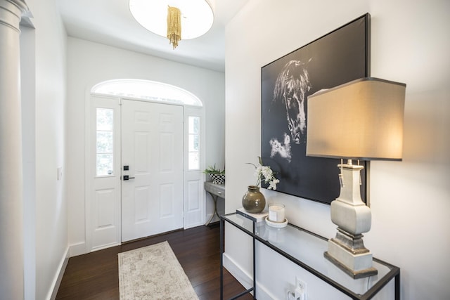 entryway with dark hardwood / wood-style flooring