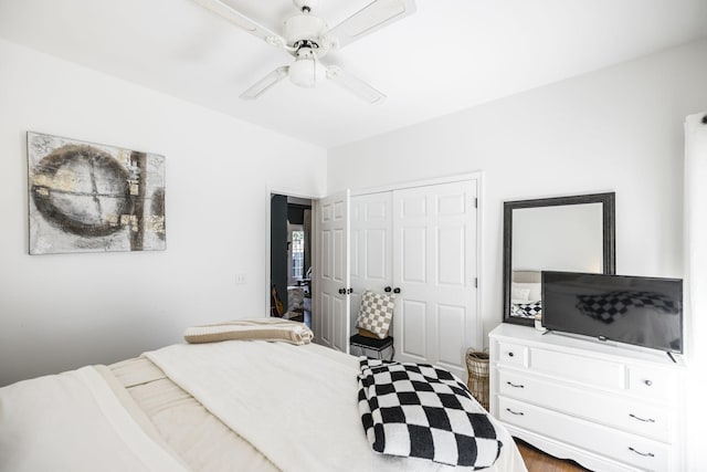 bedroom featuring ceiling fan and a closet