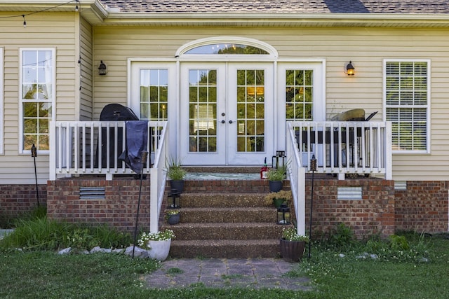 property entrance featuring french doors