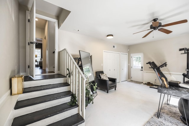 interior space featuring ceiling fan