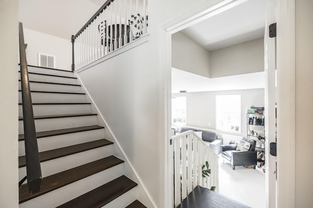 stairway with a towering ceiling