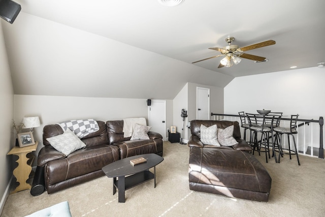 living room featuring ceiling fan, light colored carpet, and lofted ceiling