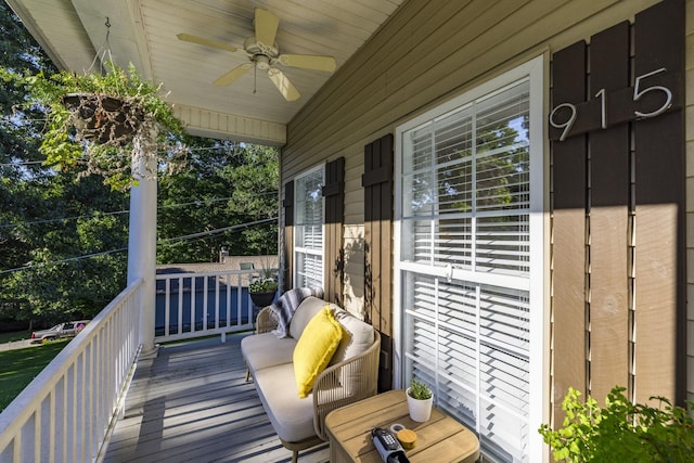 exterior space with a porch and ceiling fan