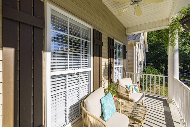 balcony with covered porch and ceiling fan