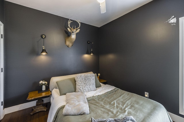 bedroom with hardwood / wood-style floors and ceiling fan