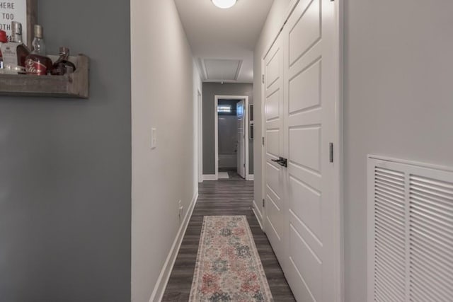 corridor featuring dark hardwood / wood-style flooring