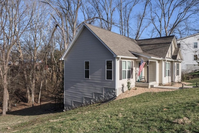 view of property exterior with a lawn