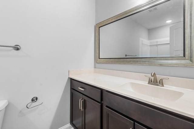 bathroom with vanity and toilet