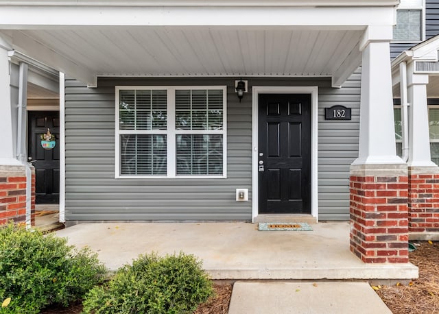 entrance to property with covered porch