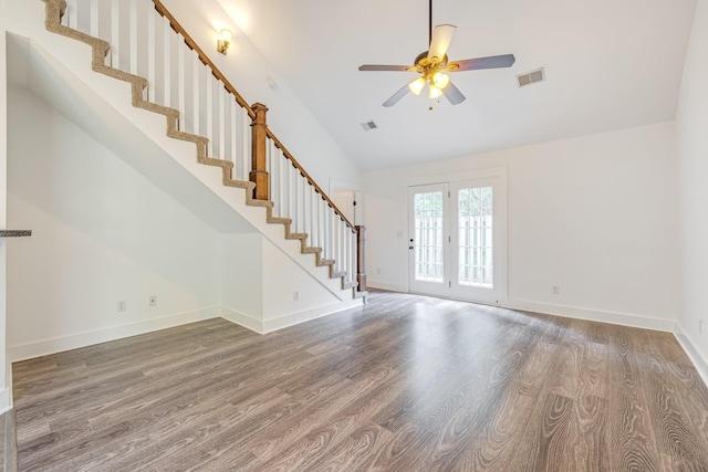 unfurnished living room featuring ceiling fan, french doors, lofted ceiling, and hardwood / wood-style flooring