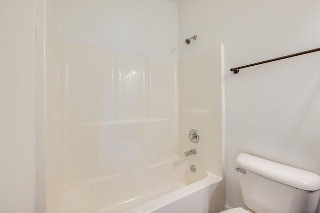 bathroom featuring toilet and tub / shower combination