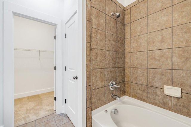 bathroom with tile patterned flooring and tiled shower / bath combo