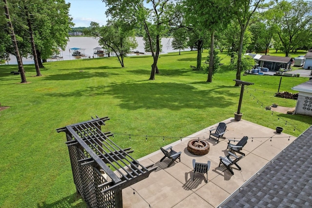 surrounding community with a yard, a fire pit, and a patio area