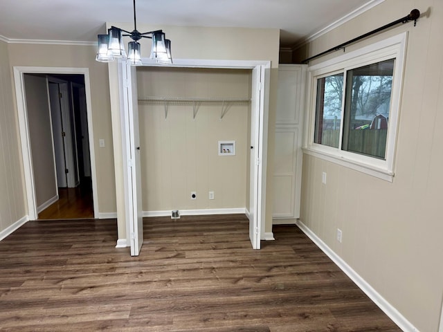 washroom with electric dryer hookup, an inviting chandelier, crown molding, hookup for a washing machine, and dark hardwood / wood-style floors