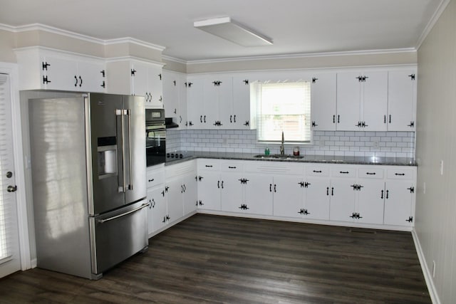 kitchen featuring decorative backsplash, white cabinetry, sink, and black appliances