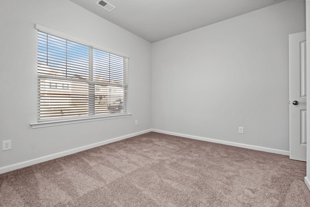 spare room with light carpet