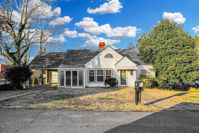 view of front of home featuring a carport