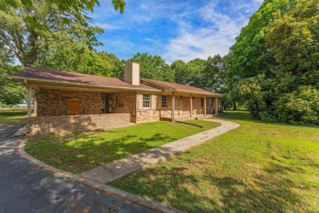 ranch-style home with a front yard