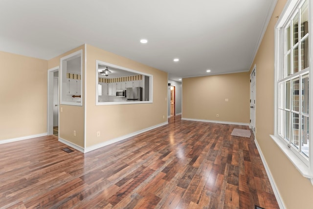 unfurnished room with crown molding and dark wood-type flooring