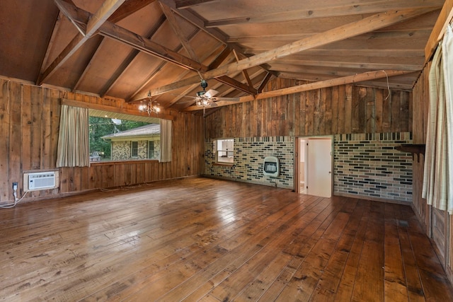 misc room featuring a wall mounted air conditioner, hardwood / wood-style floors, wood walls, lofted ceiling with beams, and heating unit