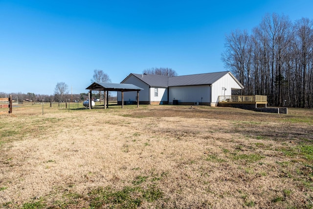 view of yard featuring a gazebo, a wooden deck, and a rural view