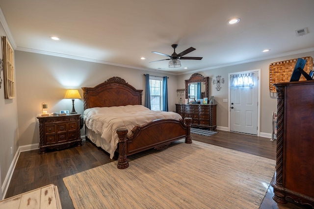 bedroom featuring ceiling fan, ornamental molding, and dark wood-type flooring