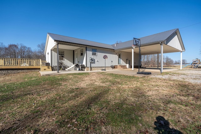 rear view of house with a yard