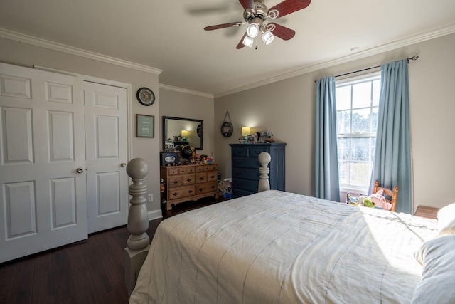 bedroom featuring a closet, dark hardwood / wood-style floors, ceiling fan, and crown molding