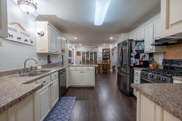 kitchen featuring white cabinets, sink, dark hardwood / wood-style flooring, kitchen peninsula, and stainless steel appliances