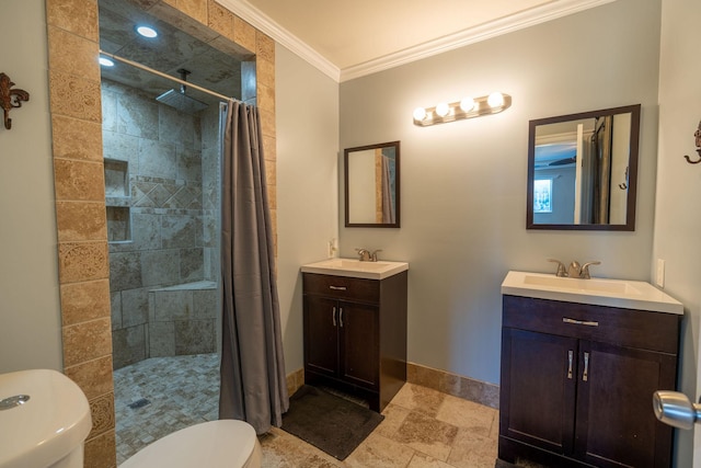 bathroom with vanity, toilet, curtained shower, and ornamental molding