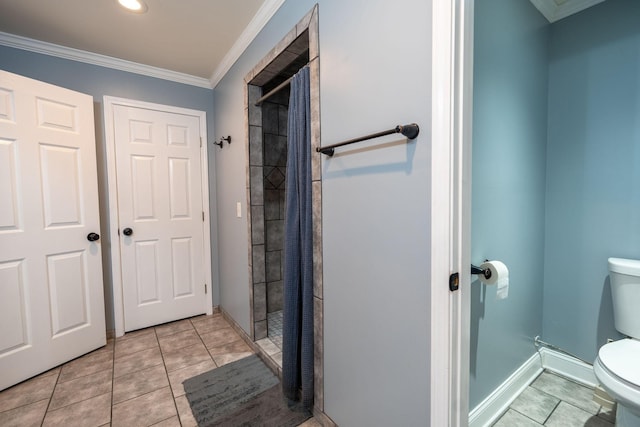 bathroom featuring tile patterned flooring, a shower, toilet, and ornamental molding